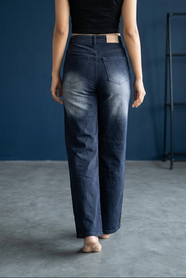Woman wearing Pavline dark indigo high waist wide leg denim jeans with a black crop top for a modern Korean-inspired casual look.