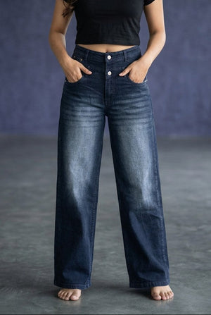 Woman wearing Pavline dark indigo high waist wide leg denim jeans with a black crop top for a modern Korean-inspired casual look.
