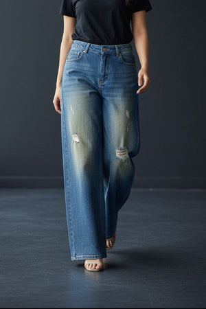 Pavline women's vintage blue wide leg high rise denim jeans with subtle distressed detailing.