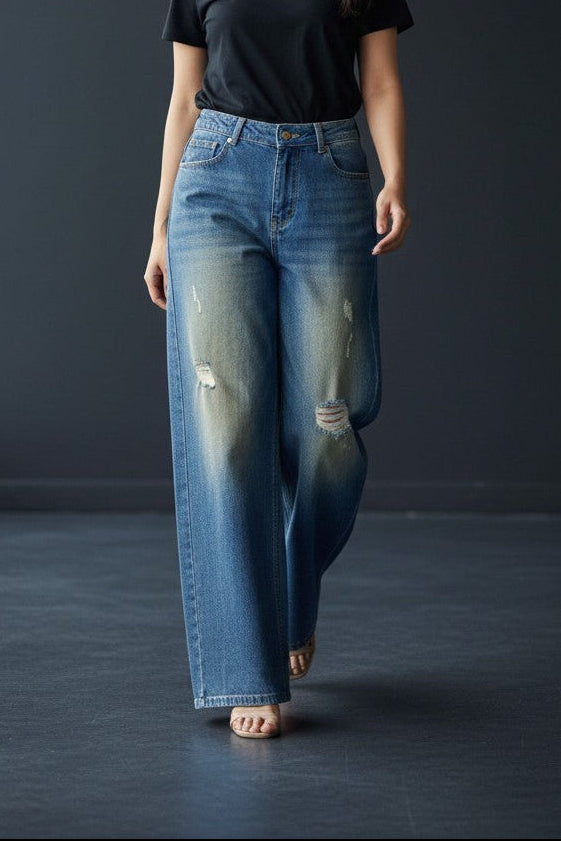 Pavline women's vintage blue wide leg high rise denim jeans with subtle distressed detailing.