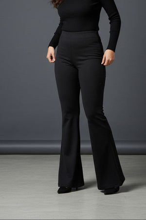 Woman wearing Pavline premium high waist black flared pants with sleeveless black top for office and casual fashion.