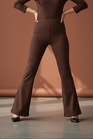 Woman wearing Pavline premium high waist brown flared pants with sleeveless black top for office and casual fashion.