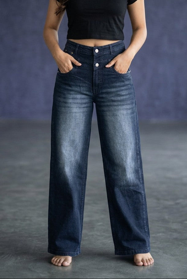 Woman wearing Pavline dark indigo high waist wide leg denim jeans with a black crop top for a modern Korean-inspired casual look.