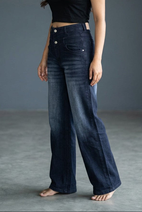 Woman wearing Pavline dark indigo high waist wide leg denim jeans with a black crop top for a modern Korean-inspired casual look.