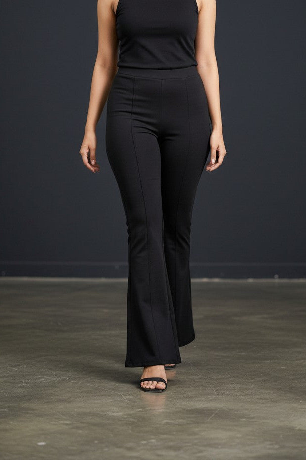 Woman wearing Pavline premium high waist black flared pants with sleeveless black top for office and casual fashion.