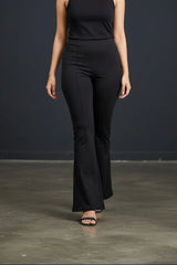 Woman wearing Pavline premium high waist black flared pants with sleeveless black top for office and casual fashion.