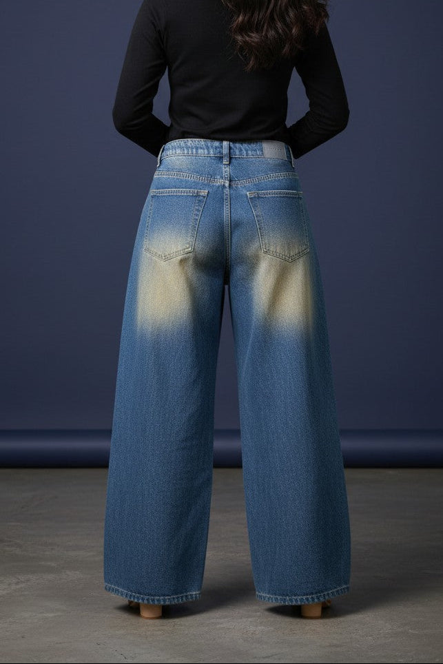 Pavline women's vintage blue wide leg high rise denim jeans with subtle distressed detailing.