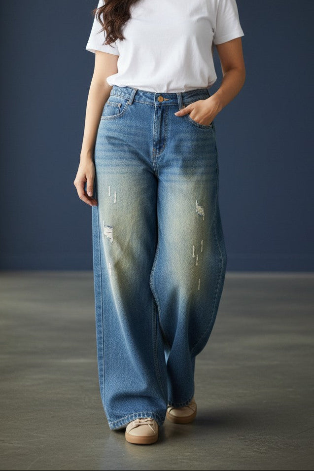 Pavline women's vintage blue wide leg high rise denim jeans with subtle distressed detailing.